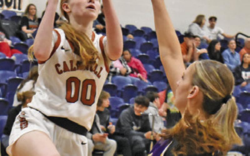 IRELAND MORGAN shoots over a La Grange player during the Caldwell-La Grange game last Friday night at Hornet Gym. Tribune photo by Roy Sanders