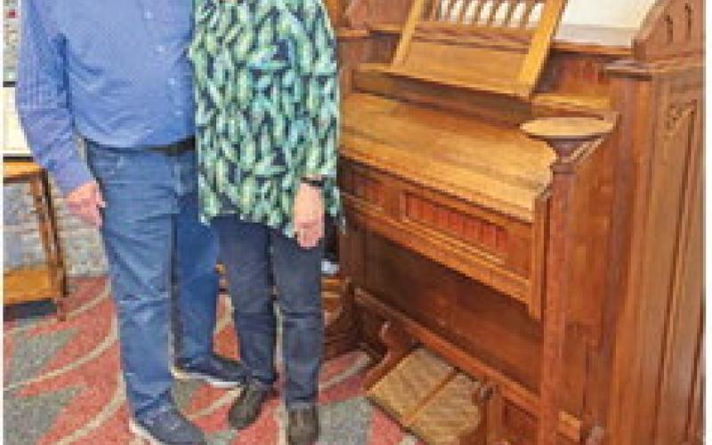 RUFUS AND AGNES Lamere stand next to the historic organ.