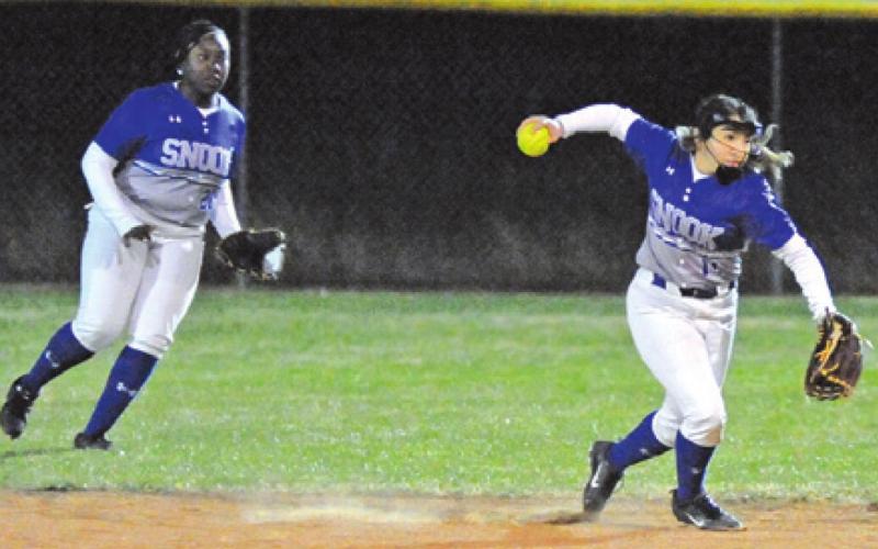 SNOOK’S NADIA GARCIA sets to throw the ball while Makenzie Moore looks on during the Lady Jays’ game against Anderson-Shiro.