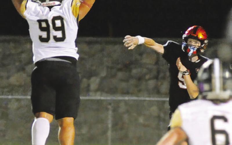SOMERVILLE’S BARRETT HOWE hurls this pass as a Buda Johnson defender tries to intercept. -- Tribune photo by Denise Squier