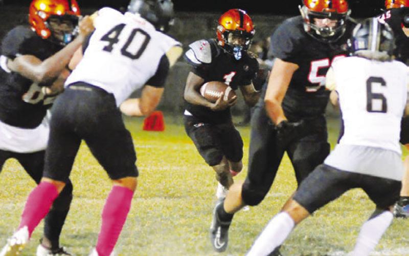 HERSCHEL CONWAY RUNS for yardage for Somerville against Buda Johnson last Friday. -- Tribune photo by Denise Squier