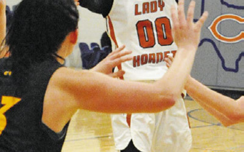 CALDWELL’S JAE MATHIS scores a basket towards her teamleading 22 points against Thorndale last Friday night at Hornet Gym.