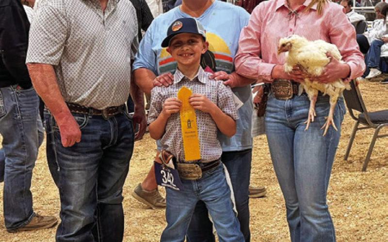 RIXTON MANTEY OF BURLESON COUNTY 4-H placed 25th with his pullets at HLSR, earning a spot in the auction. His sister Kanzie Mantey, also pictured, placed 11th with her pullets, making an auction spot as well. Other Burleson County 4-Hers who earned an auction spot at HLSR with broilers include Kenner Mantey (8th place pullets), Grace Mantey (27th place pullets), Colby Ferrell (20th place pullets), Carson Ferrell (27th place cockerels) and Jaida Heater (38th place pullets). Photo courtesy of Megan Rogers