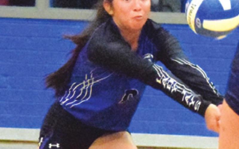SNOOK SENIOR PAOLA Arredondo dives to bump the ball during the Lady Jays match against Madisonville last Tuesday night in Snook. -- Tribune photo by Denise Squier