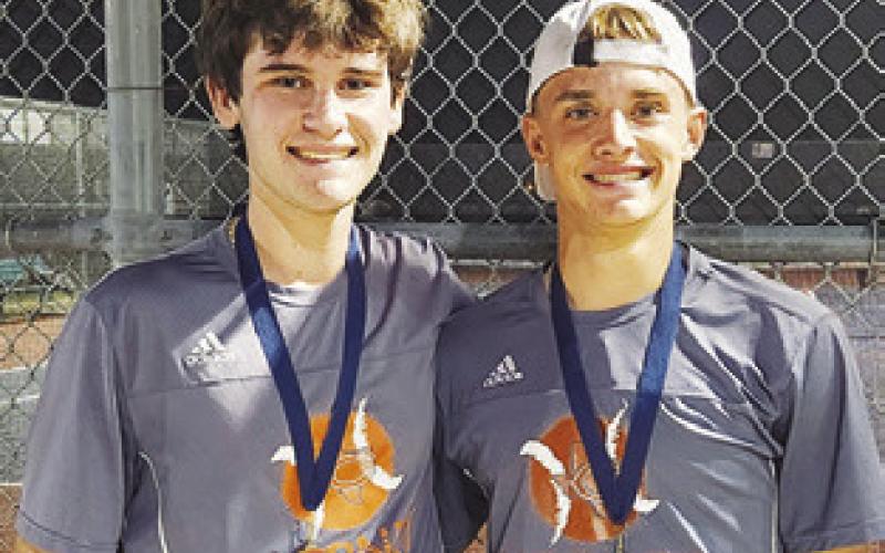 CONNOR HUGHSON and Waylon Chapman placed first in Boys Doubles at the Madisonville Mustang Invitational Varsity #2 Tournament.