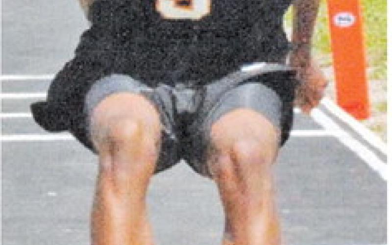 BRANDYN CARTER is pictured competing in the triple jump at the Area Track Meet in Snook.