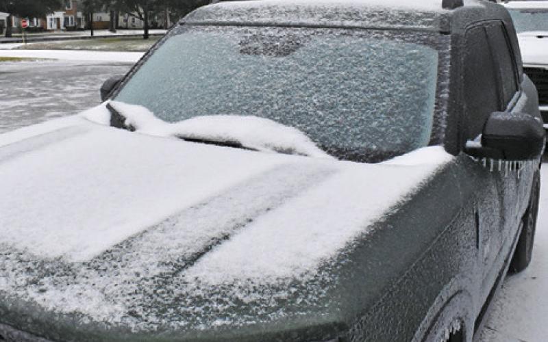 ICE ACCUMULATES ON this car off Harvey Street in Caldwell. Tribune photo by Roy Sanders