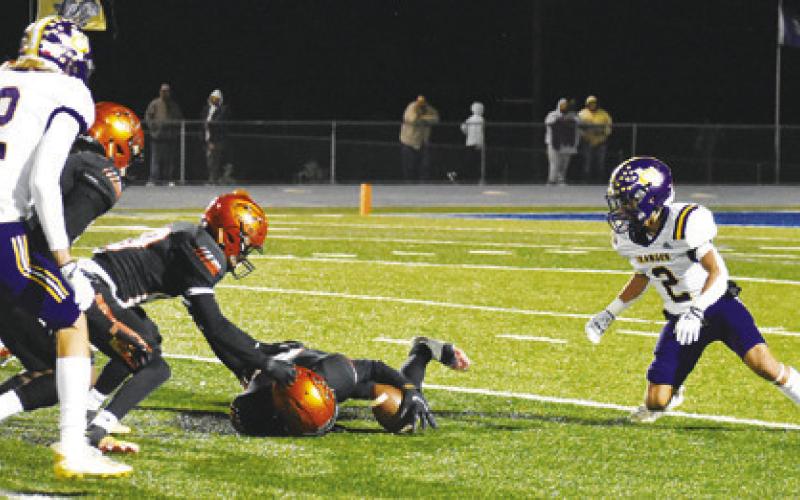 DOMINIC TUCKER OF Somerville grabs this fumble as Victor Orozco moves in the Somerville-Granger game last Friday in Rockdale. -- Tribune photo by Roy Sanders