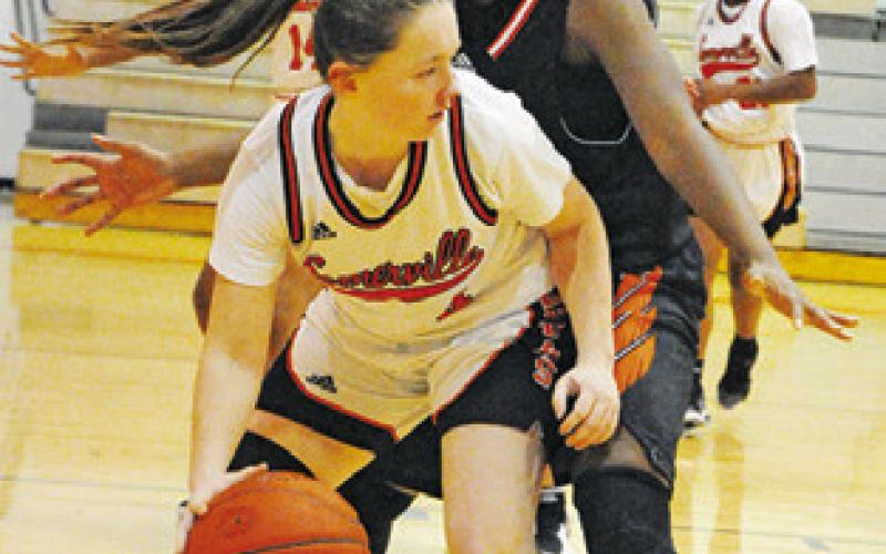 MONTANA GUINN looks to pass to someone during the Somerville-Smithville game last Friday. -- Tribune photo by Denise Squier