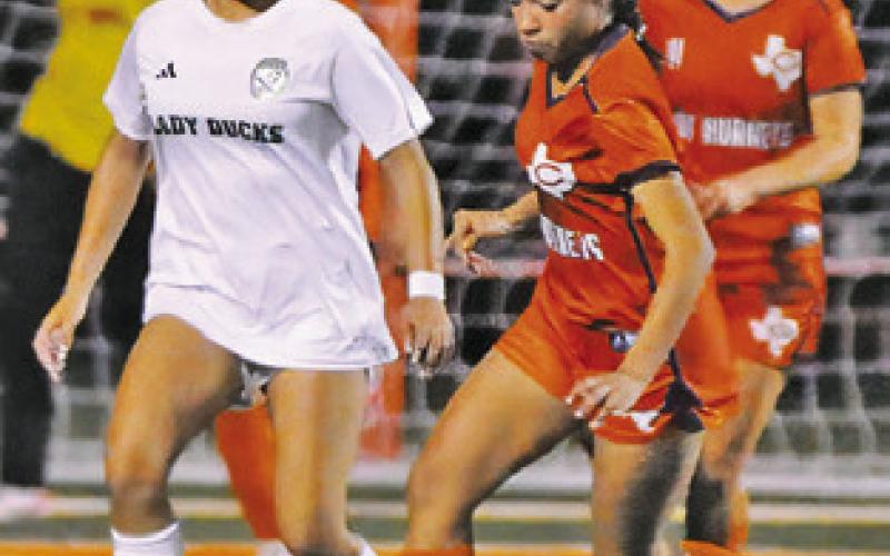NATASHA GUTIERREZ clears the ball from in front of the Caldwell goal during the Lady Hornets’ game against Taylor on Friday.