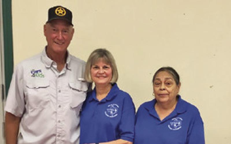 THE SNOOK EEA TRAVEL Club was present at the Back to School Blast on Tuesday, Aug. 5, at the Burleson County Expo Center. Pictured, from left, are Dennis Gaas, Karen Gaas and Maria Olivarez.
