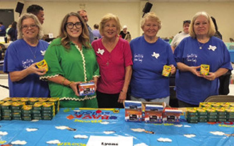 LYONS EVANGELICAL CHURCH gave out crayons and glue sticks at the Back to School Blast on Tuesday, Aug. 5, at the Burleson County Expo Center. Pictured, from left, are Tammy Qualls-Tucker, Tammi Skrhak, Claudia Pitman, Sharon Stevenson and Terri Sissom.