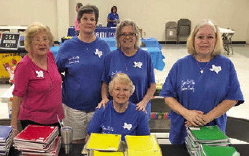 THE LYONS EXTENSION CLUB gave out notebooks at the Back to School Blast on Tuesday, Aug. 5, at the Burleson County Expo Center. Pictured, from left, standing are Claudia Pitman, Brenda Kolojaco, Tammy Qualls-Tucker, Terri Sissom and, seated, Sharon Stevenson.