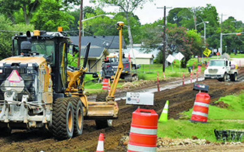 WORK CONTINUES ON F.M. 975 in Caldwell. Texas Materials Group is working on this TxDOT project to rehabilitate the road, redo the curb and gutter and upgrade drainage. Work is being done from State Highway 21 West to the railroad overpass. Completion is set for the spring of 2026.