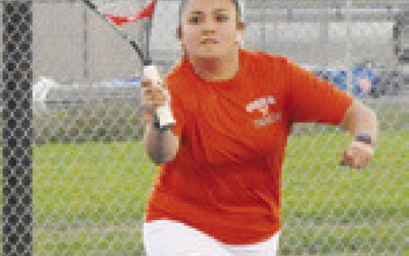 SOMERVILLE’S VIVI-ANNA Munoz returns the ball over the net during a girls’ doubles match at the Caldwell Varsity Tennis Tournament last week.