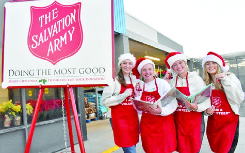 CALDWELL HIGH SCHOOL students Ava Gordon, Mia Witherwax, Hadleigh Novosad and Izzy Burlin ring the bell on Monday for the Salvation Army at the Caldwell Walmart store.