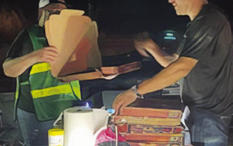 CERT TEAM members respond on Monday at the County Road 324 fire.