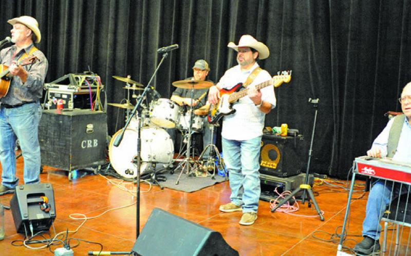 CROSSROADS BAND PROVIDED the music for the “dancing” portion of Saturday’s “Denim, Dinner &amp;amp; Dancing Gala,” hosted by the Caldwell Burleson County Lions Club. Tribune photo by Denise Squier