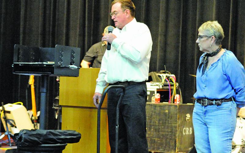 WES HANCOCK, CALDWELL High School Ag teacher, presented a grill and other items donated by his class to the Caldwell Burleson County Lions Club during the “Denim, Dinner &amp;amp; Dancing Gala.” Tribune photo by Denise Squier