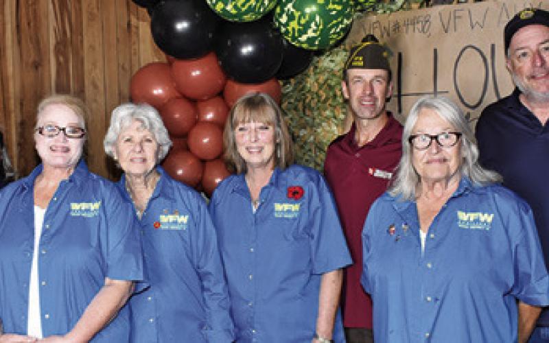 CALDWELL VFW AUXILIARY members are pictured last Saturday, Nov. 8, at the house party at the VFW post. They include, from left, Lisa Harrell, Jennifer Fraustro, Patsy Hughes, Karen Bolt and Gayle Rhodes. Also pictured are Jonah Harrell of the VFW and Lee Hoermann of the American Legion posts.