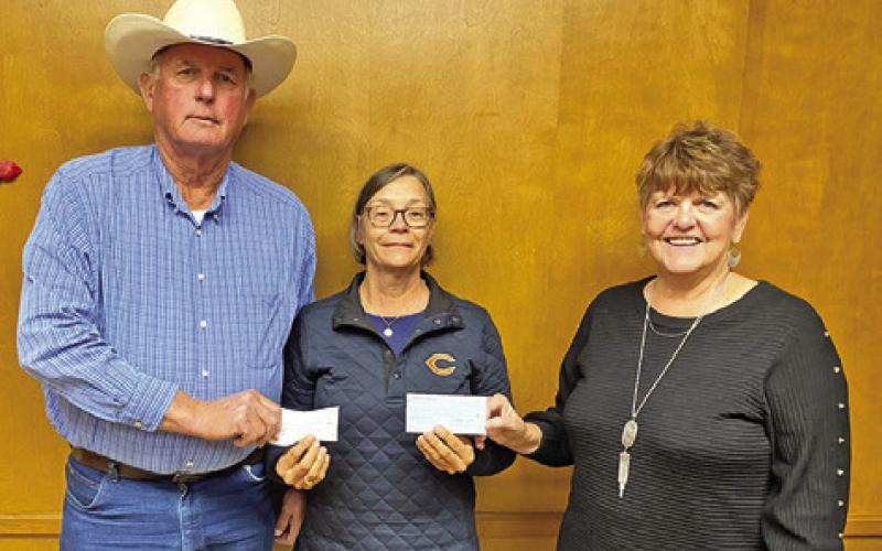 KJT SOCIETY #12 donated $1,250 to the Elizabeth Community Pantry, due to matching funds from the May dance and donations from the home office of the KJT Memorial Foundations. Presenting the check was Franklin Karasek, president, left; Linda Gaas, secretary/ treasurer of KJT #12, right; and Kim Boetger, office administrator of the Elizabeth Community Pantry, center. Not pictured is Willie Hobbs, director of the community pantry.