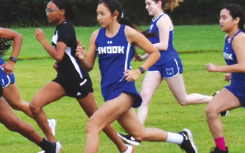 SOMERVILLE AND SNOOK GIRL varsity runners start their race at the District 26-2A Cross Country Meet last week at Davidson Creek Park. Pictured, from left, are Ra’Maya Carter, Destiny Vela, Paola Arrendondo-Nino and Carmen Miller. -- Tribune photo by Roy Sanders
