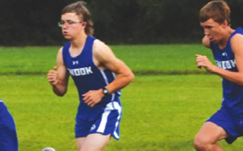 SNOOK BOY CROSS COUNTRY runners Tristan Yen, John See and Brett Withem take off from the starting line of last week’s District 26- 2A boys’ varsity cross country race. -- Tribune photo by Roy Sanders