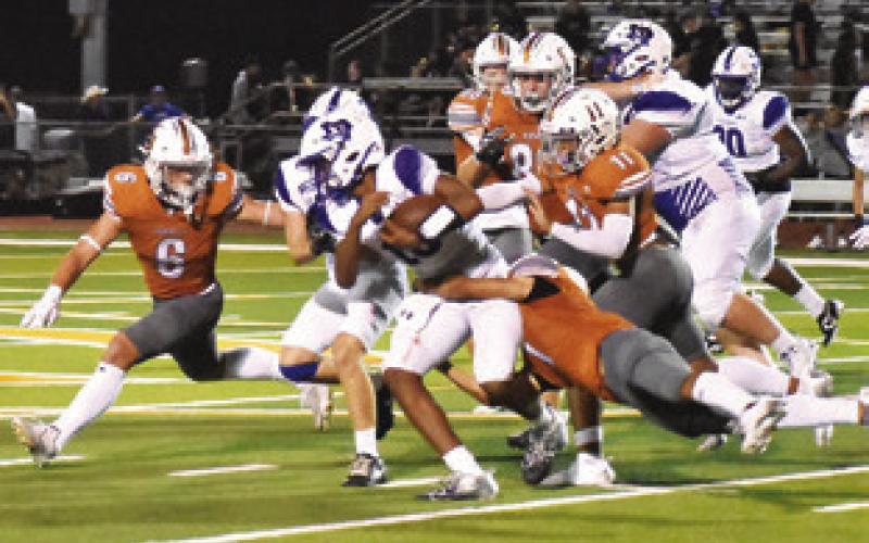 THE CALDWELL DEFENSE, including Jaxon Anderson and Zane Brown move in on this Jarrell ball carrier last Friday.