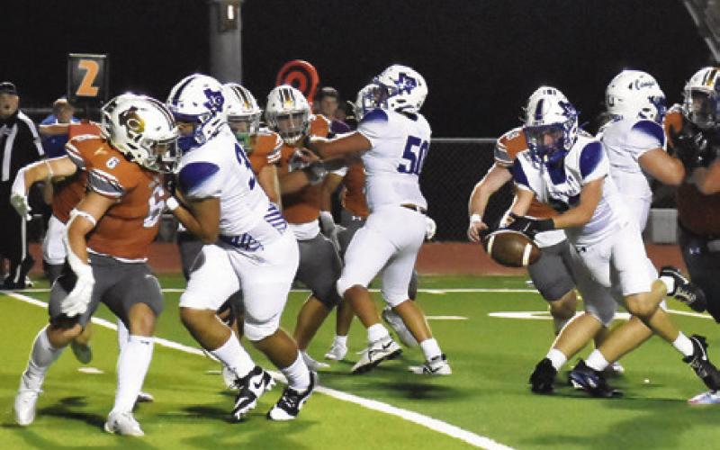 THE BALL COMES loose from this Jarrell ball carrier in last Friday’s game against Jarrell. Tribune photo by Roy Sanders
