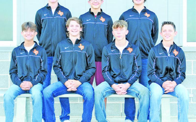 THE 2022 CALDWELL HORNET CROSS country team is, from left, sitting, Spencer Ellis, Daniel Bardin, Travis Cunningham, Rowdy Smith, standing, Colby Maresh, Jack McClosky and Cooper Ellis. Not pictured are Nathan Scott, Will McDonald and Chris Marshall. -- Photo courtesy of Dianne Pursch Photography