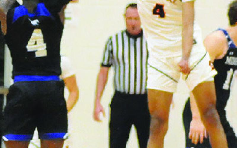 KEVIN GAINES OF Somerville blocks this Mumford shot. Tribune photo by Denise Squier
