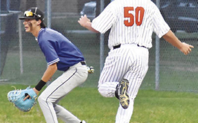 NICK CONNELY races to first base and is safe against Mumford last Friday.