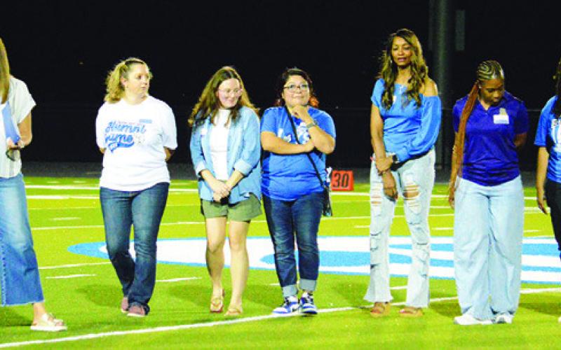 SNOOK’S 2011 AND 2012 state champion girls track teams were recognized on Friday at the Snook-St. Stephen’s football game. Tribune photo by Kim Hutcheson