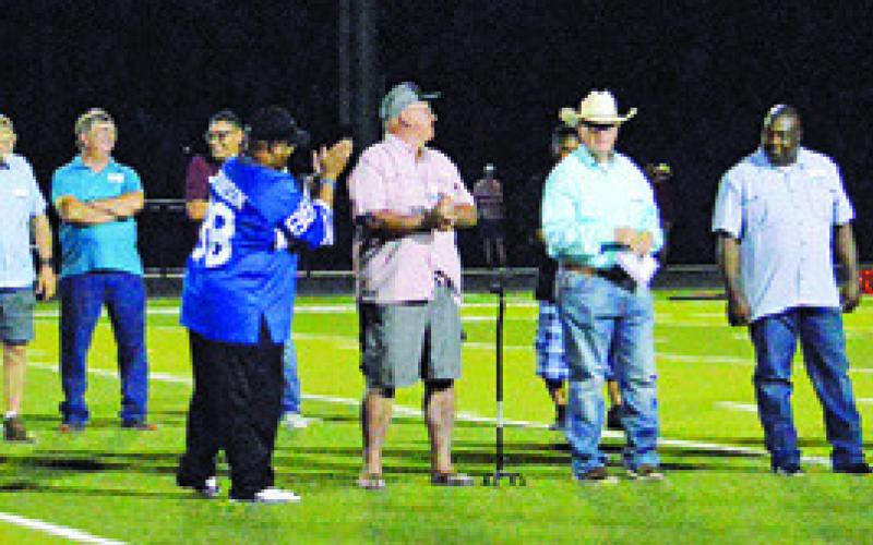 SNOOK’S MEMBERS OF THE 1979-82 state track champions were recognized on Friday at the Snook-St. Stephen’s football game. Snook also had the 2000 state champion cross country team. Tribune photo by Kim Hutcheson