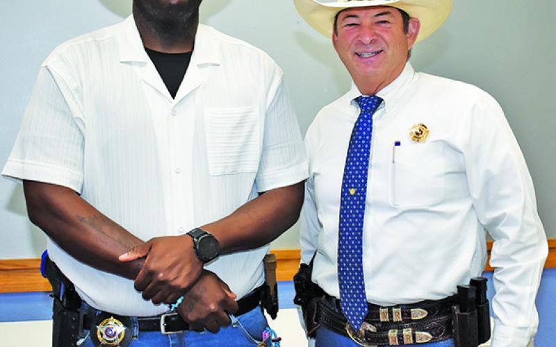 JEROME PLAIR is joined by Sheriff Bill Rios at his swearing in ceremony on Monday.