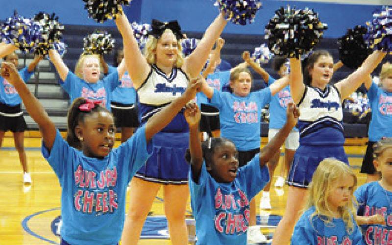 CURRENT AND FUTURE SNOOK Bluejay cheerleaders perform during Monday’s “Meet the Bluejays” in the high school gym. Tribune photo by Denise Squier