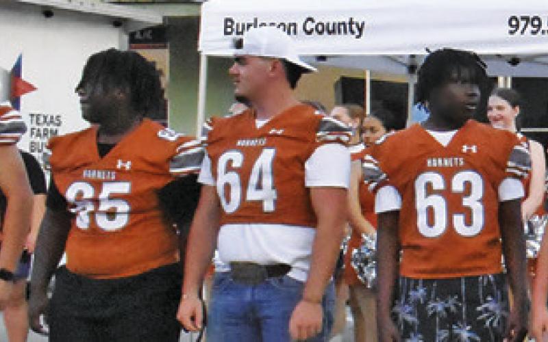 CALDWELL HIGH SCHOOL football team members greet the gathering on Saturday night at Meet the Hornets.