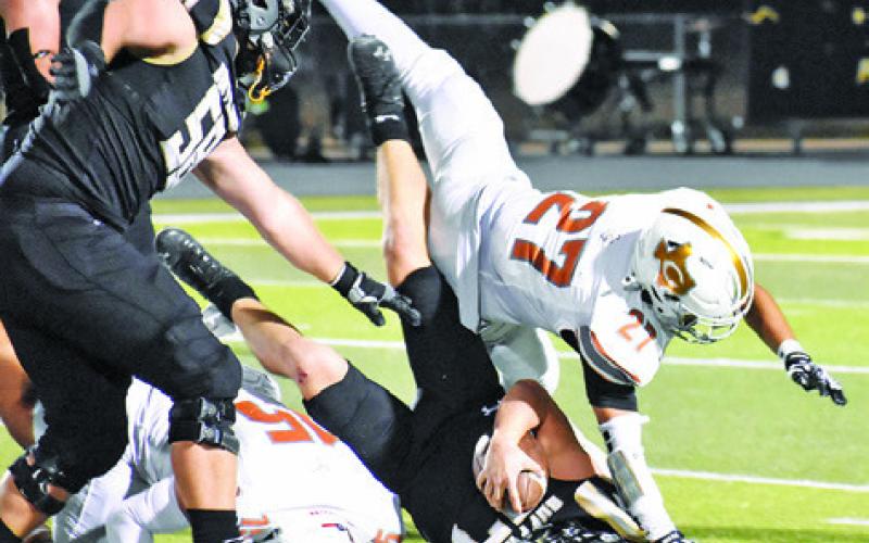 NATE REYES OF Caldwell dives in for this tackle last Friday against Giddings. The Hornets lost their district opener 52-35. Tribune photo by Roy Sanders