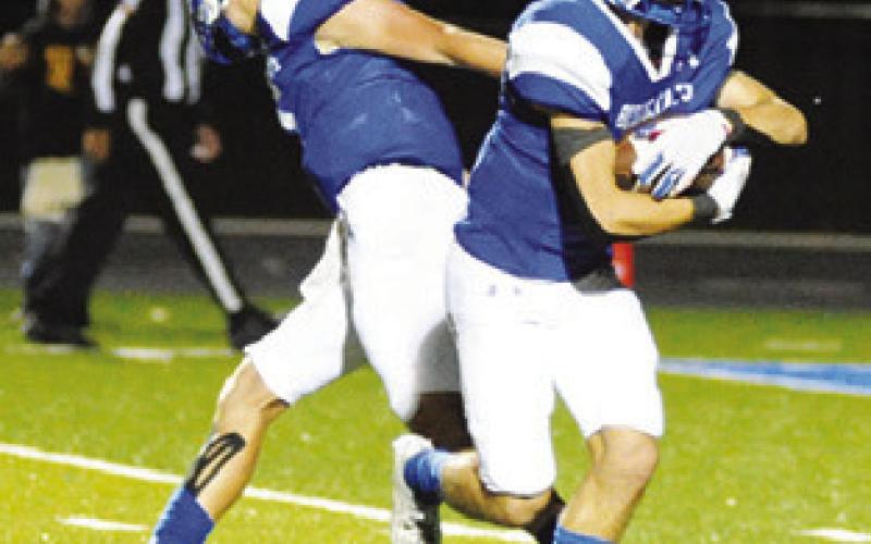 LANCE LARA carries the ball for Snook. Lara finished with 119 yards on 13 carries. -- Tribune photo by Denise Squier