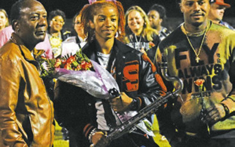 RA’MAYA CARTER IS named Somerville High School Band Sweetheart at halftime of the Somerville-Burton game last Friday. She is joined by Carl Idlebird, SHS band director, left, and her father Robert Carter, right. -- Tribune photo by Roy Sanders