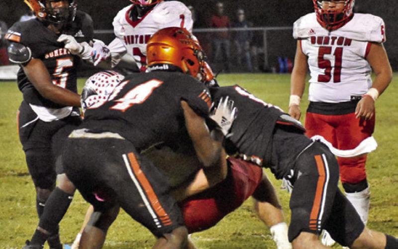 THE YEGUAS’ DEFENSE tackles this Burton ball carrier last Friday in Somerville. -- Tribune photo by Roy Sanders