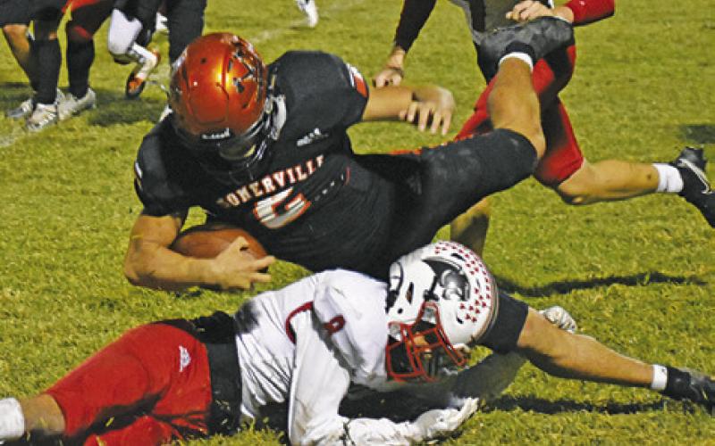 SOMERVILLE’S IAN TEAGUE dives for extra yardage against Burton in Somerville. -- Tribune photo by Roy Sanders