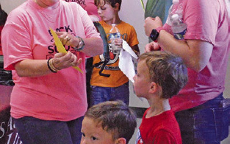 AGRILIFE EXTENSION Agent Holly Narro gives parents instructions at last week’s “Back-to-School Bash.” Tribune photo by Kimberly Hutcheson