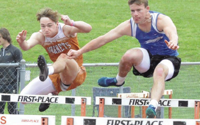 CALDWELL’S BRAXTON FRITCHER leaps over a hurdle during last week’s Happy Skrabanek Relays. -- Tribune photo by Denise Squier