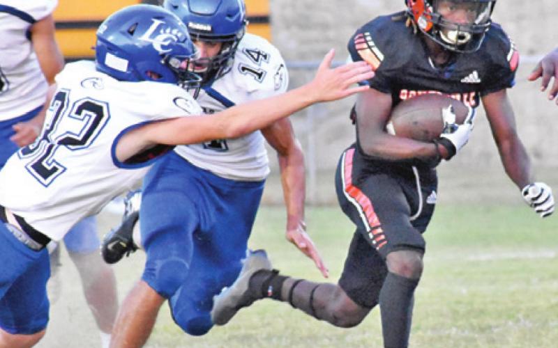 HERSCHEL CONWAY makes a catch for Somerville against Leon.