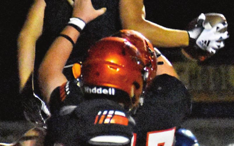 THE YEGUAS CELEBRATE after a big play against Leon. Pictured are Ian Teague, Cullen Sablatura and Gardner Shivers.