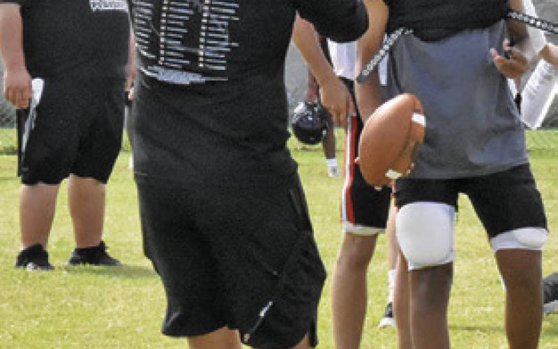 NEW SOMERVILLE Head Coach Luke Klingler talks to his players during a practice session.