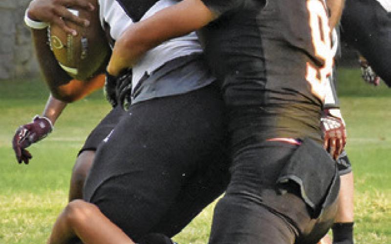 SOMERVILLE’S GREGORY Fowler and Martin Espinoza make a tackle against Hearne.