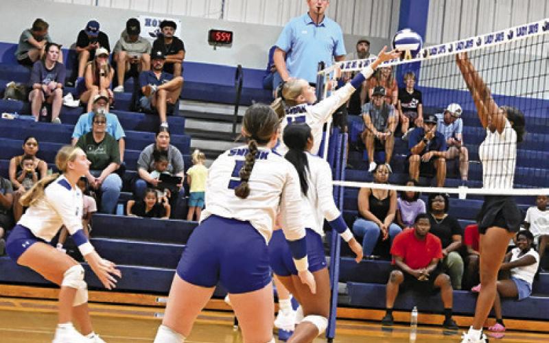 THERE WERE SEVERAL battles at the net during Friday’s Lady Jay alumni volleyball scrimmage at the high school gym. Tribune photo by Denise Squier
