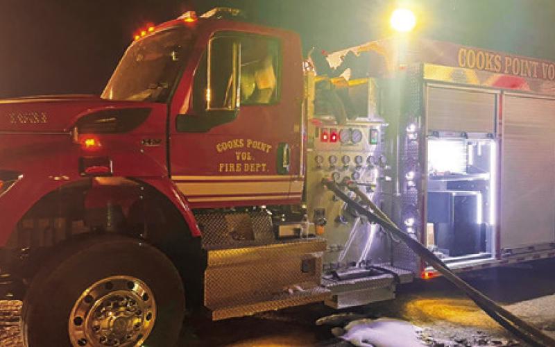 COOKS POINT’S FIRE truck is used at the Oct. 30 fire at State Highway 21 East. Numerous hay bales were lost in the fire. Photo courtesy of Cooks Point Volunteer Fire Deparment